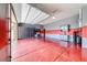 Spacious garage with epoxy floors, custom cabinets, and ample storage space at 9920 Rancho Destino Rd, Las Vegas, NV 89183