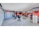 Spacious garage featuring ample storage, a pool table, lounge area, and a well-organized layout at 9920 Rancho Destino Rd, Las Vegas, NV 89183