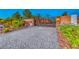 View of stone and stucco walls with wrought iron security gate at 9920 Rancho Destino Rd, Las Vegas, NV 89183