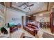 Inviting living room showing a leather sofa set, elegant decor, and an adjacent kitchen with a breakfast nook at 9920 Rancho Destino Rd, Las Vegas, NV 89183