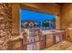 Modern outdoor kitchen with stainless steel grill and granite countertops, perfect for entertaining at 9920 Rancho Destino Rd, Las Vegas, NV 89183