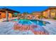 Beautiful outdoor pool with unique rock features and a spa area at 9920 Rancho Destino Rd, Las Vegas, NV 89183