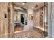 Walk-in shower featuring marble bench, glass door and dual shower heads at 9920 Rancho Destino Rd, Las Vegas, NV 89183