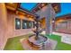 Stone water fountain in front of a single-story home at 9920 Rancho Destino Rd, Las Vegas, NV 89183