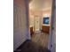 Well-lit bathroom with walk-in shower, wood vanity cabinets and wood-look tile floors at 7701 W Robindale Rd # 127, Las Vegas, NV 89113