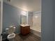 Full bathroom featuring a shower-tub combination, wood vanity cabinet and fresh, neutral paint at 7701 W Robindale Rd # 127, Las Vegas, NV 89113