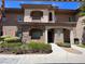 Inviting condo with a stone facade, balcony, desert landscaping and neutral exterior paint colors at 7701 W Robindale Rd # 127, Las Vegas, NV 89113
