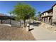 Community walking path surrounded by desert landscaping and mature trees at 7701 W Robindale Rd # 127, Las Vegas, NV 89113