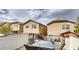 Balcony view overlooking neighboring houses, with outdoor dining table and woven chairs at , Las Vegas, NV 89148