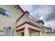 Exterior of house featuring a balcony with iron railings and red brick design elements at , Las Vegas, NV 89148