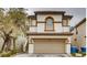 Charming two-story home with a tan exterior, tiled roof, and a convenient two-car garage at , Las Vegas, NV 89148