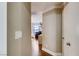 Hallway with hardwood floors leading to bedrooms and a view of the living area at , Las Vegas, NV 89148