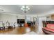 Spacious living room featuring hardwood floors, chandelier, and adjacent dining area for flexible living at , Las Vegas, NV 89148
