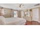 Serene primary bedroom with neutral tones, a ceiling fan, and ample natural light at , Las Vegas, NV 89148