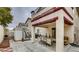 Covered patio area with an outdoor dining table, furniture, and access to the backyard at , Las Vegas, NV 89148