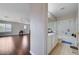 Well-lit bathroom with a shower and vanity and a view into the living room at 11120 Whooping Crane Ln, Las Vegas, NV 89144