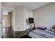 Bedroom view featuring hall entrance and small desk with tv at 11120 Whooping Crane Ln, Las Vegas, NV 89144