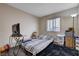 Comfortable bedroom with wood flooring, natural light, and casual décor at 11120 Whooping Crane Ln, Las Vegas, NV 89144