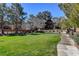 Community park with picnic tables, benches, and lush green grass at 11120 Whooping Crane Ln, Las Vegas, NV 89144