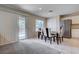 Dining area featuring sliding glass doors leading to the backyard and modern decor at 11120 Whooping Crane Ln, Las Vegas, NV 89144