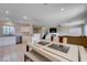 Open-concept dining area with modern table setting, connecting the kitchen and living spaces at 11120 Whooping Crane Ln, Las Vegas, NV 89144