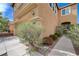 Three-quarter view of a two-story home with an attached two-car garage at 11120 Whooping Crane Ln, Las Vegas, NV 89144