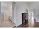 Upstairs hallway with dark wood flooring and multiple room entrances at 11120 Whooping Crane Ln, Las Vegas, NV 89144