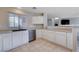 Bright kitchen area featuring modern appliances and white cabinetry with easy access to the living spaces at 11120 Whooping Crane Ln, Las Vegas, NV 89144