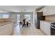 Spacious kitchen seamlessly connects to the dining area, featuring modern appliances and a functional layout at 11120 Whooping Crane Ln, Las Vegas, NV 89144
