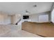 Cozy living room with a comfortable sofa, fireplace, and staircase to the upper level at 11120 Whooping Crane Ln, Las Vegas, NV 89144
