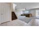 Inviting living room featuring staircase, neutral paint, and ample natural light at 11120 Whooping Crane Ln, Las Vegas, NV 89144