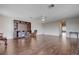 Spacious living room with hardwood floors, a ceiling fan and built-in shelving with living room access at 11120 Whooping Crane Ln, Las Vegas, NV 89144