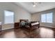 Spacious main bedroom featuring wood floors, natural light, and fan at 11120 Whooping Crane Ln, Las Vegas, NV 89144
