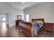 Spacious main bedroom showcasing wood floors and natural light at 11120 Whooping Crane Ln, Las Vegas, NV 89144