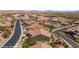 Aerial view of a residential neighborhood with well-maintained streets, landscaped yards, and solar panels on the rooftops at 1348 Basin Vw, Mesquite, NV 89034