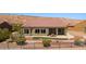 A backyard shot featuring a patio and desert landscaping at 1348 Basin Vw, Mesquite, NV 89034
