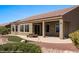 A view of the backyard, patio, landscaping, and well-maintained lawn at 1348 Basin Vw, Mesquite, NV 89034