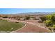 Landscaped backyard with desert landscaping and artificial grass, leading to stunning mountain views at 1348 Basin Vw, Mesquite, NV 89034