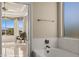 Bathroom featuring a soaking tub and an adjacent sitting room with mountain views at 1348 Basin Vw, Mesquite, NV 89034