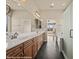Primary bathroom with double sink vanity and glass enclosed shower, with views to bedroom at 1348 Basin Vw, Mesquite, NV 89034