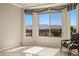 This bedroom features tile floors, a mountain view, and decorative window treatments at 1348 Basin Vw, Mesquite, NV 89034