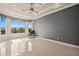 Bedroom featuring crown molding, neutral paint, large windows, and tile floors at 1348 Basin Vw, Mesquite, NV 89034