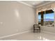 Bedroom with window and mountain view in neutral color scheme at 1348 Basin Vw, Mesquite, NV 89034