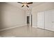 Tiled bedroom with large closet, ceiling fan, and entry to en suite bathroom at 1348 Basin Vw, Mesquite, NV 89034