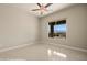 Tiled bedroom with window looking out to mountain view, and a ceiling fan at 1348 Basin Vw, Mesquite, NV 89034