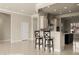 Bright open-concept kitchen features bar seating and a clear view of the stainless steel oven at 1348 Basin Vw, Mesquite, NV 89034