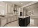 Well-equipped kitchen showcasing an island, tiled backsplash, and modern appliances creating a functional cooking space at 1348 Basin Vw, Mesquite, NV 89034