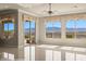 Spacious living area with mountain views through large windows and sliding glass door at 1348 Basin Vw, Mesquite, NV 89034