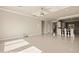 Spacious living room in neutral color scheme with recessed lighting and tile floors at 1348 Basin Vw, Mesquite, NV 89034