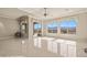 Spacious living room with multiple windows, mountain views and access to a patio at 1348 Basin Vw, Mesquite, NV 89034